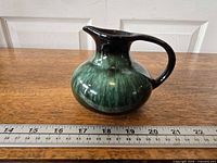 Side view showing overall form and horizontal ruler indicating width