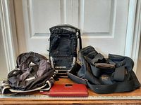 All four items: Gregory daypack, Axiom backpack, Eddie Bauer duffel, Kenneth Cole wallet