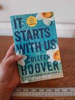 Front cover showing title, author, and floral design