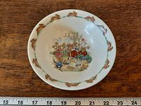 Top view showing central gardening bunny illustration and rim design