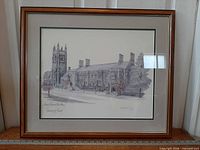 Framed print showing entire artwork, wood frame, double mat, visible inscription