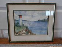 Full view of framed watercolor with frame and mat visible