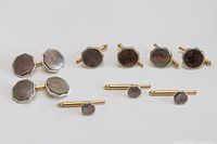 Front view showing all cufflinks and studs with mother-of-pearl faces