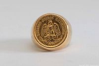 Front view showing coin face and ring bezel