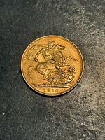 Reverse side with St George slaying dragon and 1910 date visible