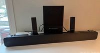 Front view of Sony soundbar with Altec Lansing subwoofer and satellites