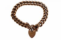 Full view of 9k gold curb link bracelet formed in circle with heart padlock clasp