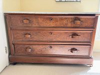 Front view showing three drawers, marble top and overall condition