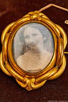 Front view showing portrait and decorative frame