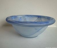 Side view of blue marbled satin glass bowl