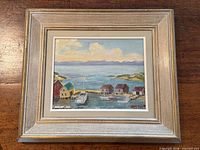 Front view of framed painting showing full artwork and frame