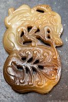Front view of carved jade dragon pendant