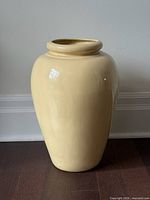 Full view of beige glazed ceramic floor vase