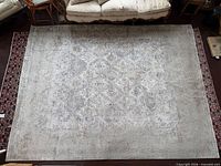 Full view of grey patterned area rug