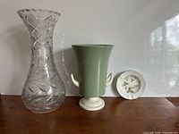 Group view of crystal vase, Wedgwood vase, Wedgwood ashtray