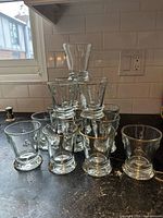 Full set of stacked tumblers showing quantity, shape and some gilded rims