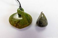 Front view of both pendants showing shapes and color