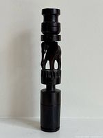 Full view of carved wooden candlestick holder