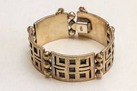 Full view showing paneled bracelet closed