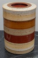 Full front view of cylindrical ceramic ice bucket showing glaze bands