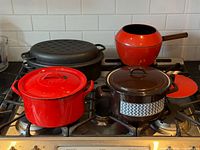 Group view of all four cookware pieces on stove