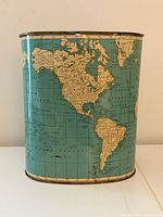 Front view showing North and South America map on teal background