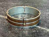 Front view showing sterling and copper banded design and clasp