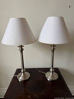 Pair of matching chrome finish table lamps with shades