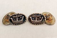 front view of both cufflinks showing longboat motif and rope edge