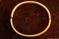 Full view of oval gold-filled bangle closed
