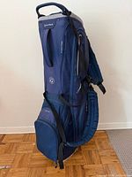 Full view of TaylorMade navy blue stand golf bag upright