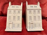 Front view of both gypsum plaster bookends showing façade details