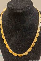 Front view showing full necklace on display bust