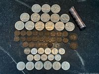 Full layout of assorted Canadian coins and penny roll