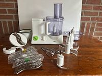 Overall view showing processor base, bowl, lid, multiple attachments