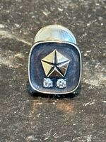 Front view of Chrysler gold service pin with diamonds