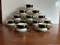 Full 24-piece set pyramid stacked on wooden surface