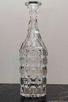 Full view of crystal decanter showing geometric cuts