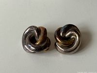 Front view of both knot clip-on earrings