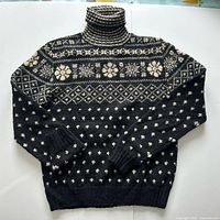 Full front view of sweater showing pattern and overall condition