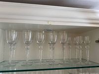 All 13 Riedel wine glasses on shelf