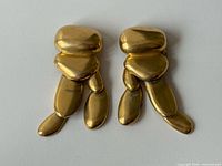 Front view of both earrings showing pebble design and gold tone