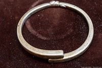 Top view of oval hinged bangle showing clasp overlap