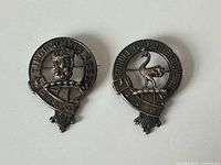 Both clan brooches front view showing overall design and size relation