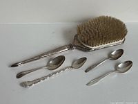 Hairbrush and four spoons layout