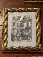 Etching of Viennese courtyard in gilt rope frame