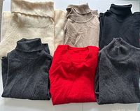 All six folded sweaters showing colors and neck styles