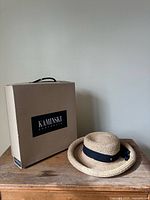 Hat and box side-by-side on table