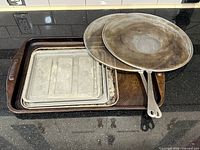 Overview of Circulon pan, two baking sheets, two splatter guards