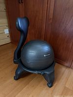 Front angle of Gaiam balance ball chair showing ball, frame and backrest